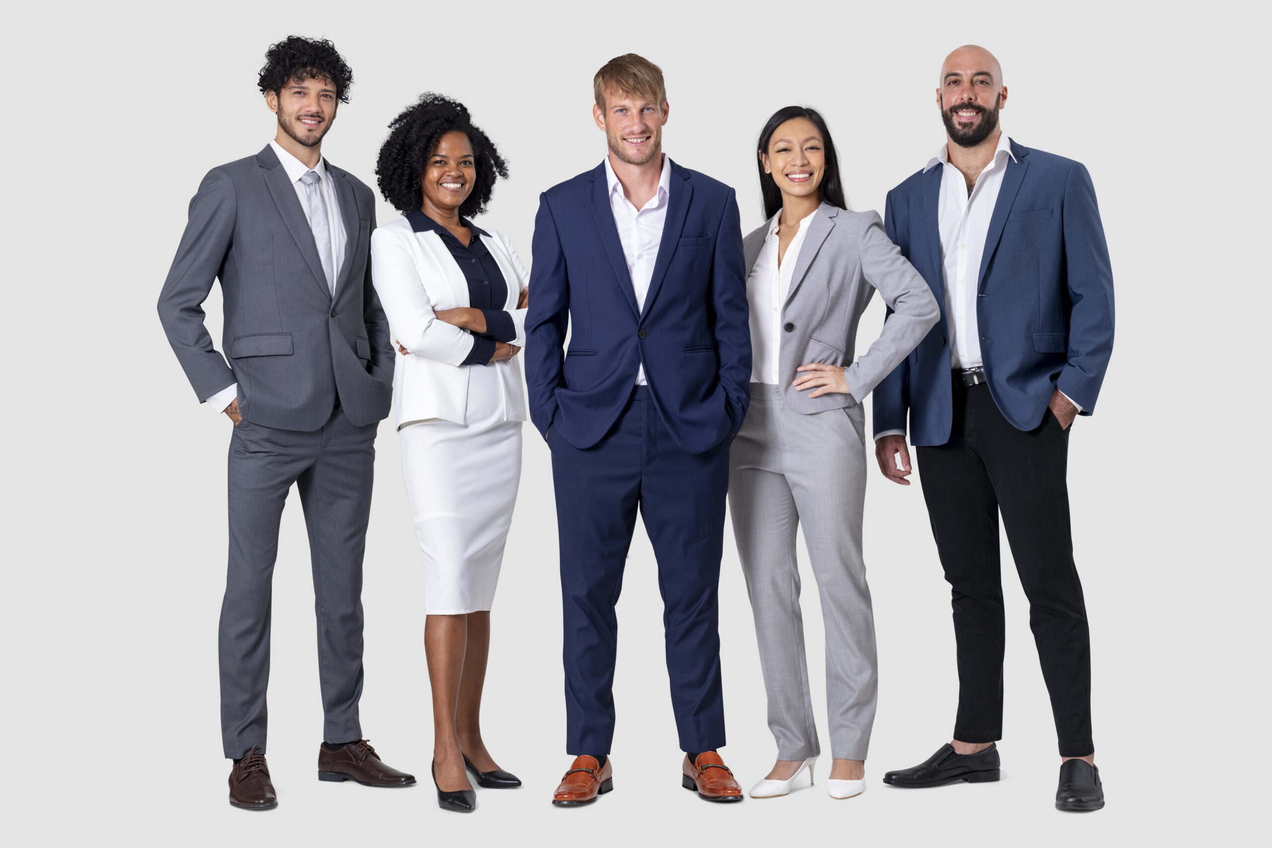 Ethnically diverse group of early to mid career engineer high potential leaders standing up confident smiling