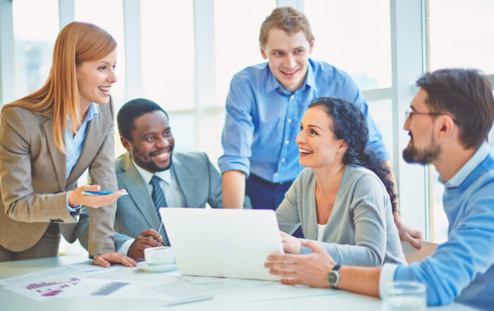 Group of early to mid-career of male and female engineers collaborating to complete an Engineers to Leaders company assessment