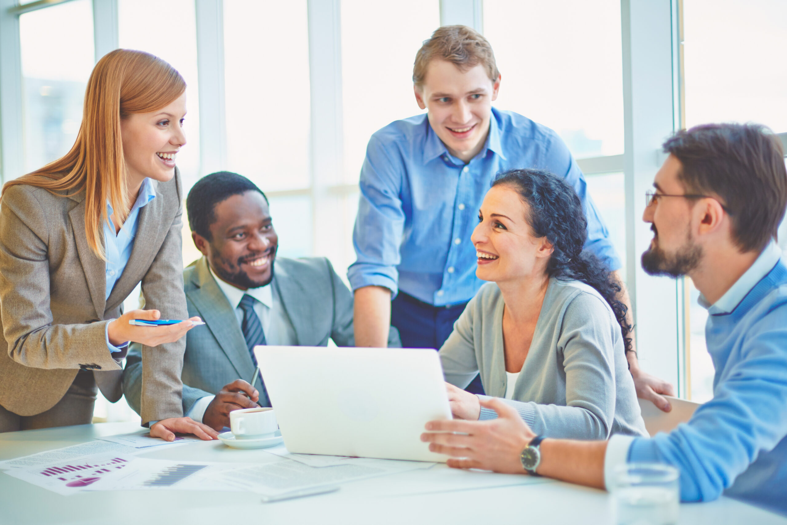 Group of early to mid-career of male and female engineers collaborating to complete an Engineers to Leaders company assessment